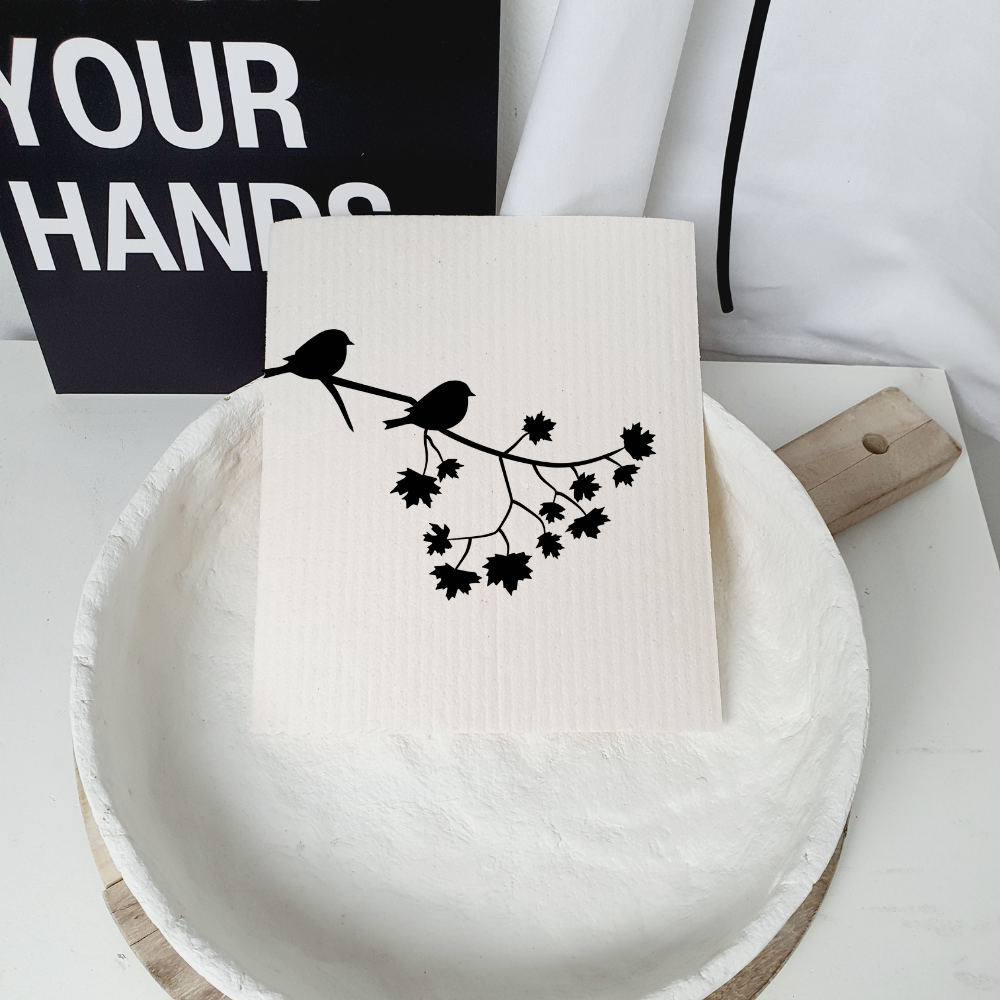 Dishcloth birds on branch