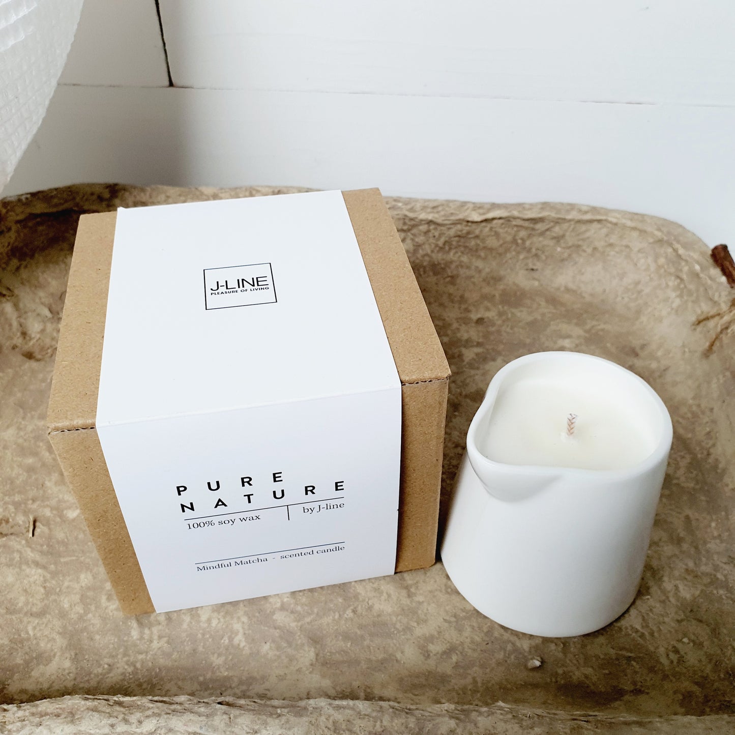 Scented candle in a jug